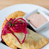 *Veggie Empanadas · savory crispy pastries filled with mixed vegetables; served with our popular spicy sriracha ...