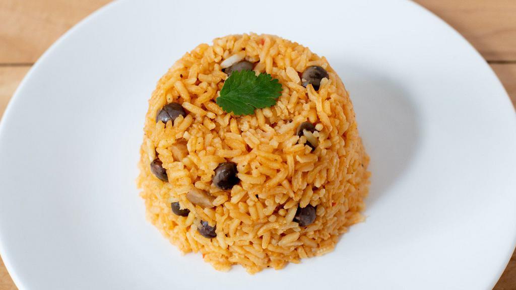 *Arroz Gandules (rice no ham) · Traditional Puerto Rican rice cooked with pigeon peas and sofrito (blend of green peppers, garlic, recao (culantro) and onions).