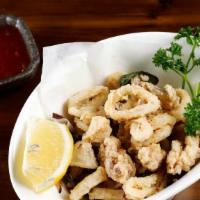 Fried Baby Calamari · Fried baby calamari marinated with shichimi spice, jalapeño and red onion. Served with sweet...