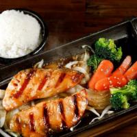 Salmon Teriyaki · Served on a sizzling platter with onion, broccoli, baby carrots, teriyaki sauce. Also comes ...
