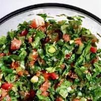Tabouli Salad · Vegetarian salad made mostly of finely chopped parsley, with tomatoes, mint, onion, bulgur, ...
