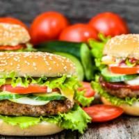 BBQ Chicken Burger · Delicious BBQ marinated chicken patty with lettuce, onions, and tomatoes.