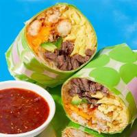 Carnitas Breakfast Burrito · Eggs, carnitas, home fries, melted cheese, caramelized onions, avocado.