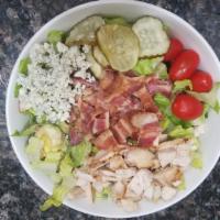 Cobb Salad · Diced chicken breast, avocado, bleu cheese crumbles, diced bacon, tomato, and egg.