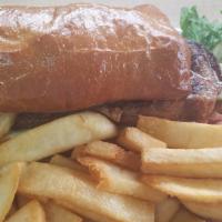 New York Steak Sandwich · Charbroiled NY Steak, cooked to your standards, served with  Fries and salad.
