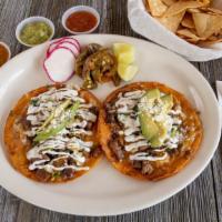 Super Taco · Superhero’s choice of taco with your choice of meat, topped with melted cheese, onions, sour...