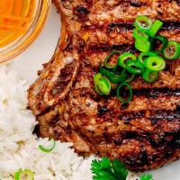 22. Grilled Pork Chop Over Rice · 
