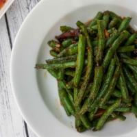 String Beans · Stir fried string beans cooked with garlic, ginger and sweet spicy sauce.