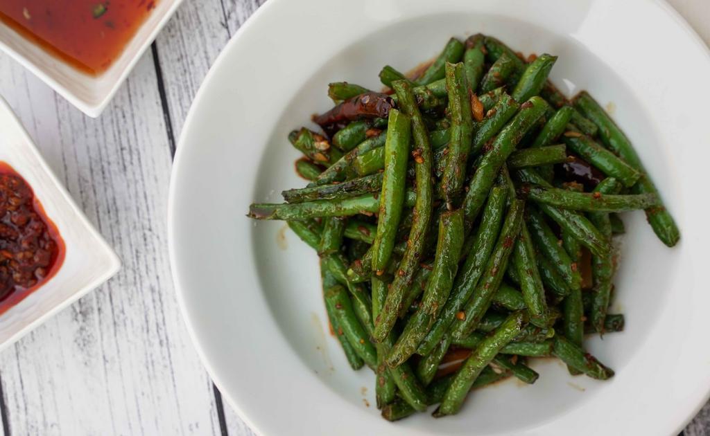 String Beans · Stir fried string beans cooked with garlic, ginger and sweet spicy sauce.