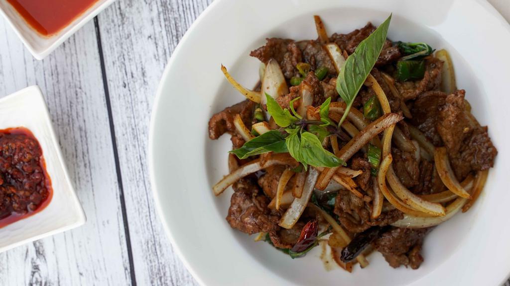 Chili Beef · Slices of beef tossed with chili sauce, garlic, onion, basil, jalapenos and chili flakes.