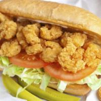 Popcorn Shrimp Po' Boy · Bite sized deep fried battered shrimp is topped with lettuce and tomato on a fresh French ro...
