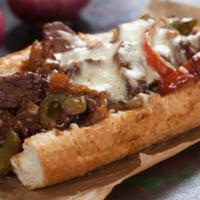 BBQ Cheesesteak · Thinly sliced fresh grilled steak layered with sweet grilled onions, tangy BBQ sauce and che...