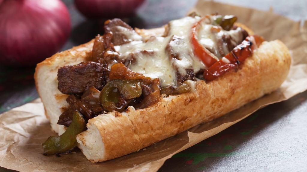 BBQ Cheesesteak · Thinly sliced fresh grilled steak layered with sweet grilled onions, tangy BBQ sauce and cheese whiz on a fresh French roll.