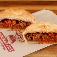 Beef & Potato Pie · Ground beef is sautéed with onions and spices then simmered with our own tomato sauce, mushr...