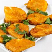 Vegetable Pakora · Mixed vegetable fritters delicately spiced.