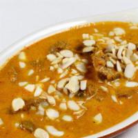 Lamb Korma · Lamb cooked in mildly cream sauce with nuts.