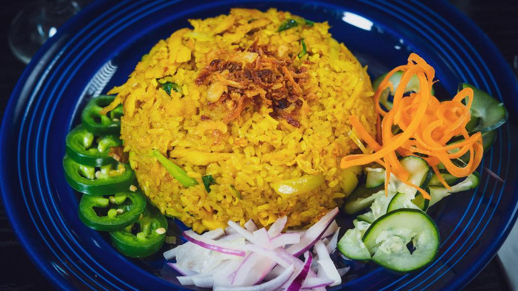Yellow Curry Fried Rice · Fried rice with egg, onion in yellow chili powder. Served with fried shallot, jalapenos, red onion on the side