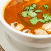 Tom Yum Noodle Soup · Rice noodles with mushroom, baby corn, lemongrass, lime juice, Thai herb in hot and sour cle...