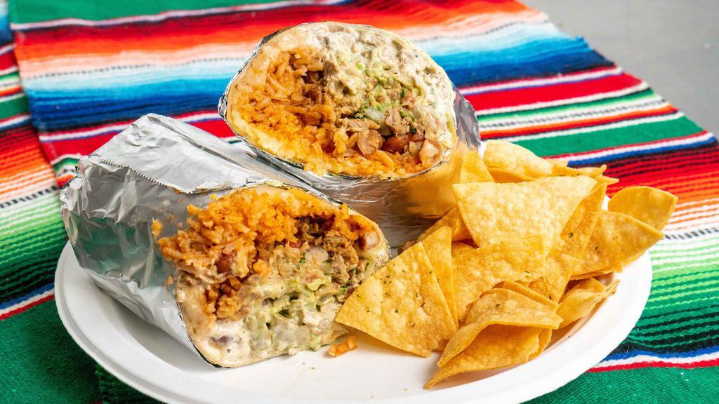Super Burrito · W/ cheese, guacamole, sour cream, rice & beans salsa.