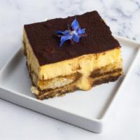 Tiramisu · A traditional Italian dessert consisting of alternating layers of imported mascarpone and la...