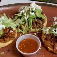 3 Sopes · Includes one beef, one al pastor, one birria, with beans, lettuce, queso fresco, and tomatil...