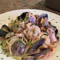 Linguine with Seafood · Clams, mussels, prawns, sea scallops, bay shrimp, calamari with alfredo, tomato, tomato crea...