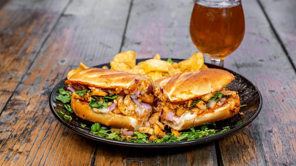 Butter Chicken Sandwich · Masala marinated chicken, red onions with creamy curry butter chicken sauce. Served on fresh baked bread that is hot and crispy.