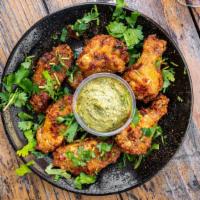 Garlic & Masala Wings (Boneless) · Spicy chicken wings marinated in masala, fresh garlic and lemon. Topped with fresh cilantro ...
