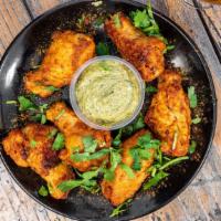 Tandoori Wings  (Bone-in) · Chicken wings marinated in yogurt with tandoori spices. Served with a side of mint chutney.