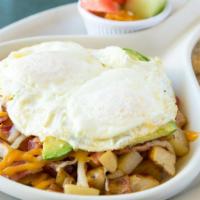 Hash Skillet · 2 ingredient skillet on hash browns and topped with 2 eggs in any style. Served with choice ...