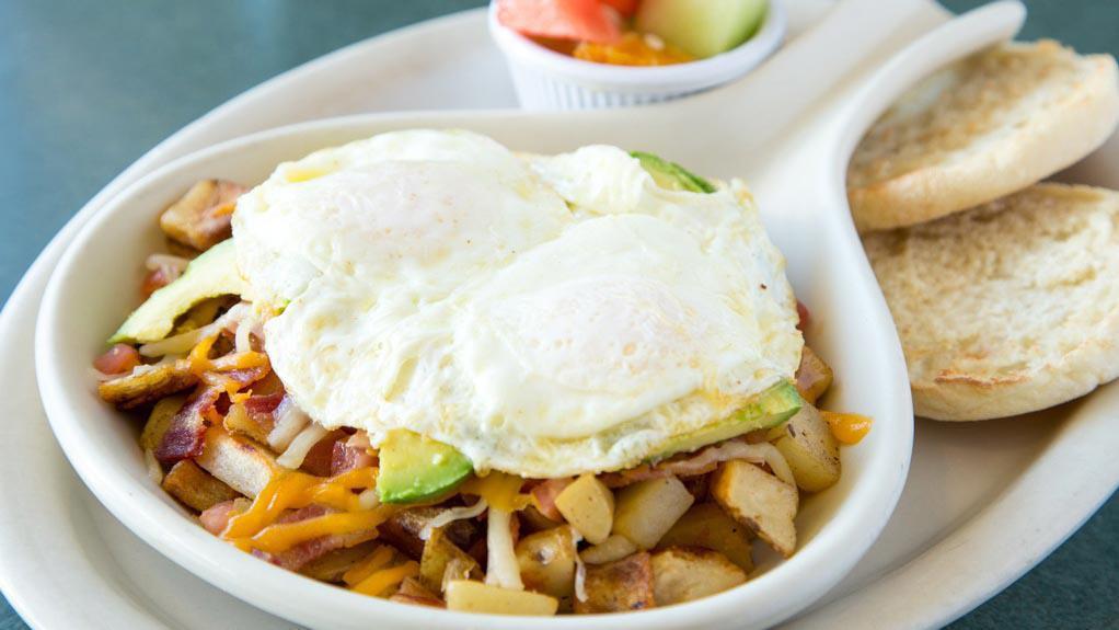 Hash Skillet · 2 ingredient skillet on hash browns and topped with 2 eggs in any style. Served with choice of toast and a fruit cup