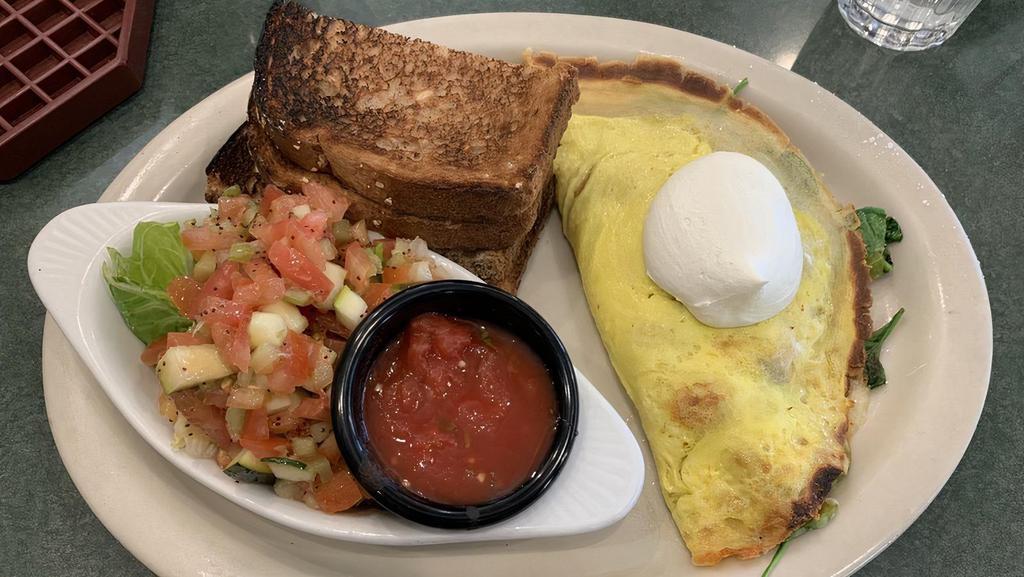 Garden Crepe · Thin sweet crepe filled with avocado, tomato, spinach, bell pepper, and Jack cheese. Topped with sour cream. Served with potatoes, your choice of bread, and a side of our homemade salsa.