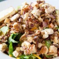 Pecan Dijon Salad · Seasoned chicken breast, bacon, avocados, pecans, tomato and shredded combo cheese. Drizzled...