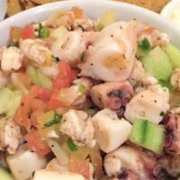 Ceviche · Lime marinated raw shrimps, tomatoes, cucumbers, onions, jalapeños, cilantro.