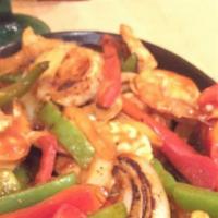Fajita · Beef or chicken grilled with bell pepper and onions.