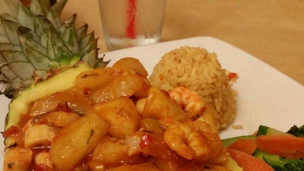 Sinaloense Tropical · Shrimp in our special sauce in a pineapple,
green onions, garlic, vegetables, and Spanish rice.