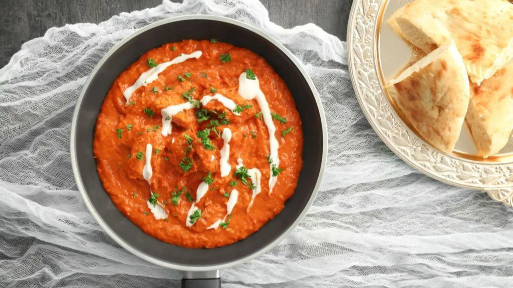 Chicken Tikka Masala · Chicken pcs baked in clay oven & cooked in creamy tomato sauce.