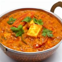 Kadai Paneer · Homemade cheese cubes cooked w/ bell peppers, onions, tomatoes & exotic spices