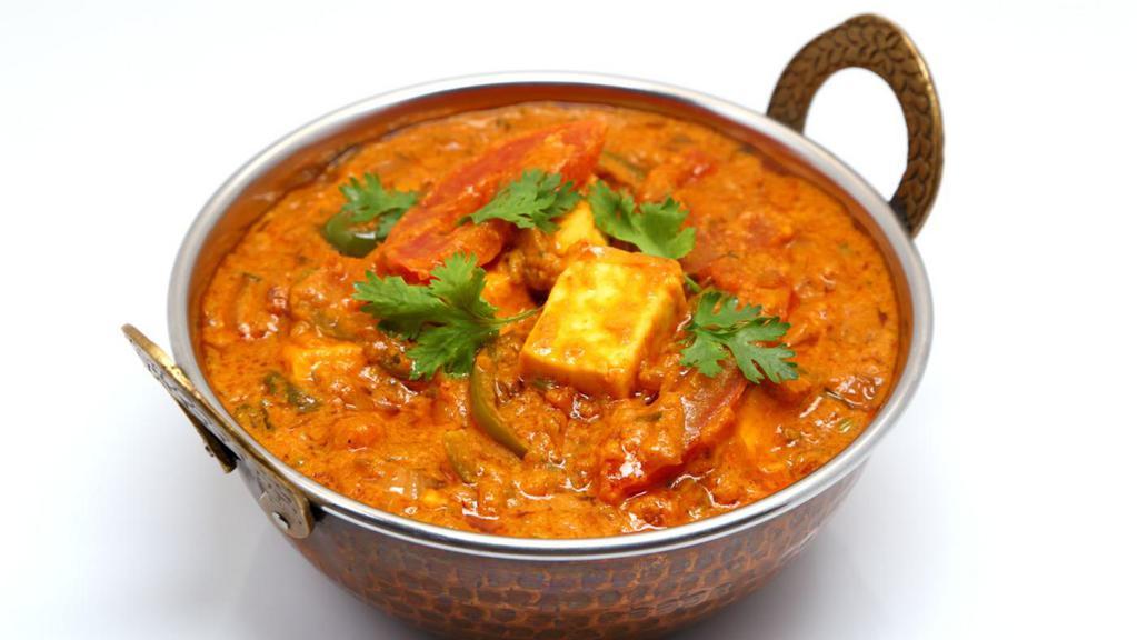 Kadai Paneer · Homemade cheese cubes cooked w/ bell peppers, onions, tomatoes & exotic spices