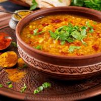 Tadka Dal · Yellow lentils w/ herbs & spices, then sauteed in butter & garnished w/fresh coriander