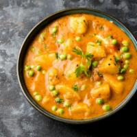 Aloo Mutter · Fresh green peas cooked w/potatoes & a variety of herbs & spices