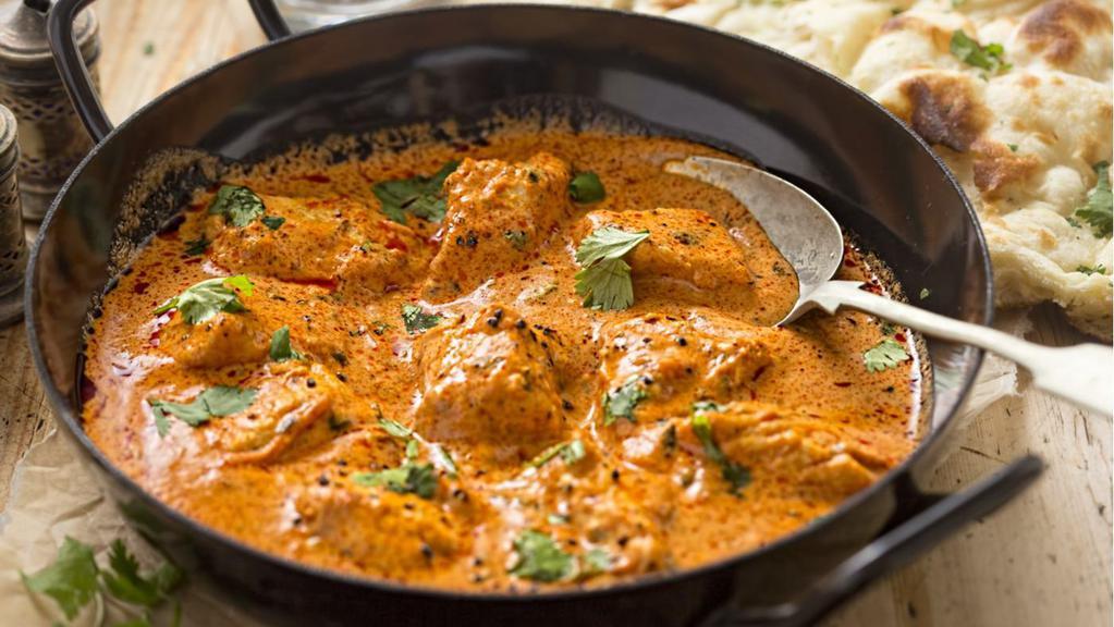 Kadai Chicken · Boneless chicken cooked w/fresh tomatoes, green peas, peppers, onions & exotic spices