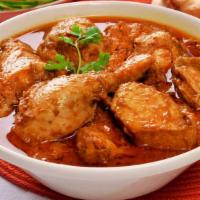 Chicken Korma · Boneless chicken cooked w/ nuts, raisins, exotic herbs & spices in a rich creamy sauce