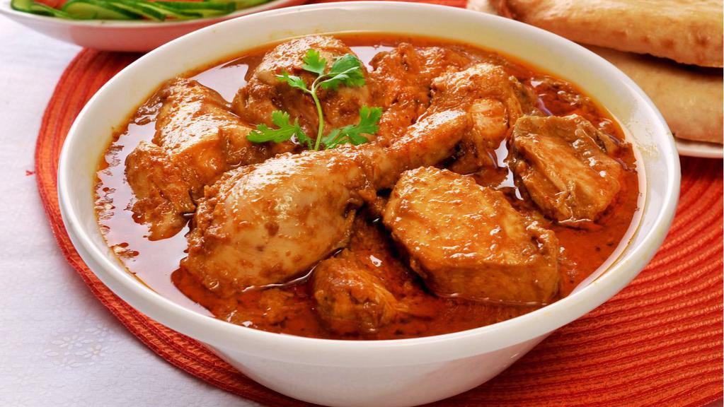 Chicken Korma · Boneless chicken cooked w/ nuts, raisins, exotic herbs & spices in a rich creamy sauce