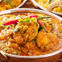 Shrimp Korma · Shrimp cooked w/ nuts, raisins, exotic herbs & spices in a rich creamy sauce