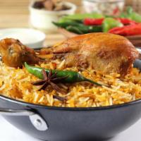 Chicken Biryani · Rice aromatically flavored with indian spices and cooked with chicken pieces. Gluten free.