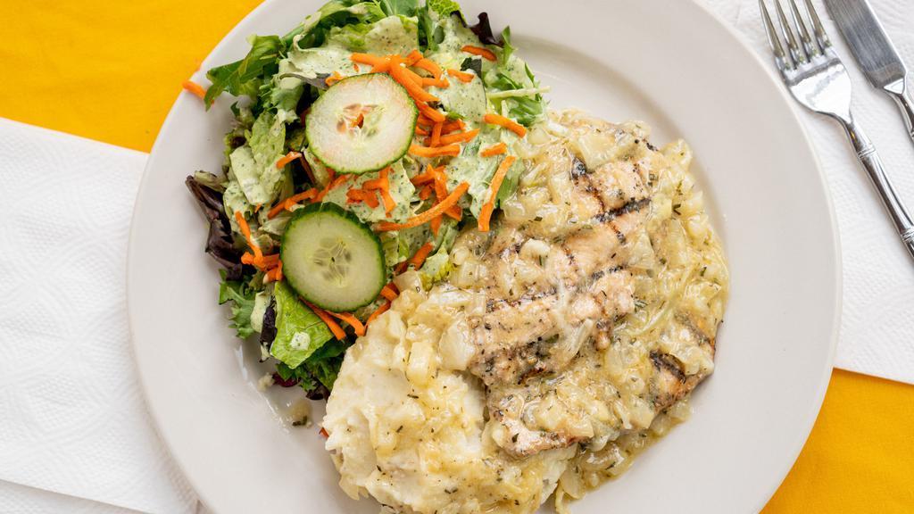 Chicken Breast with Lemon Butter & Rosemary Sauce · Served with mashed potatoes and salad.