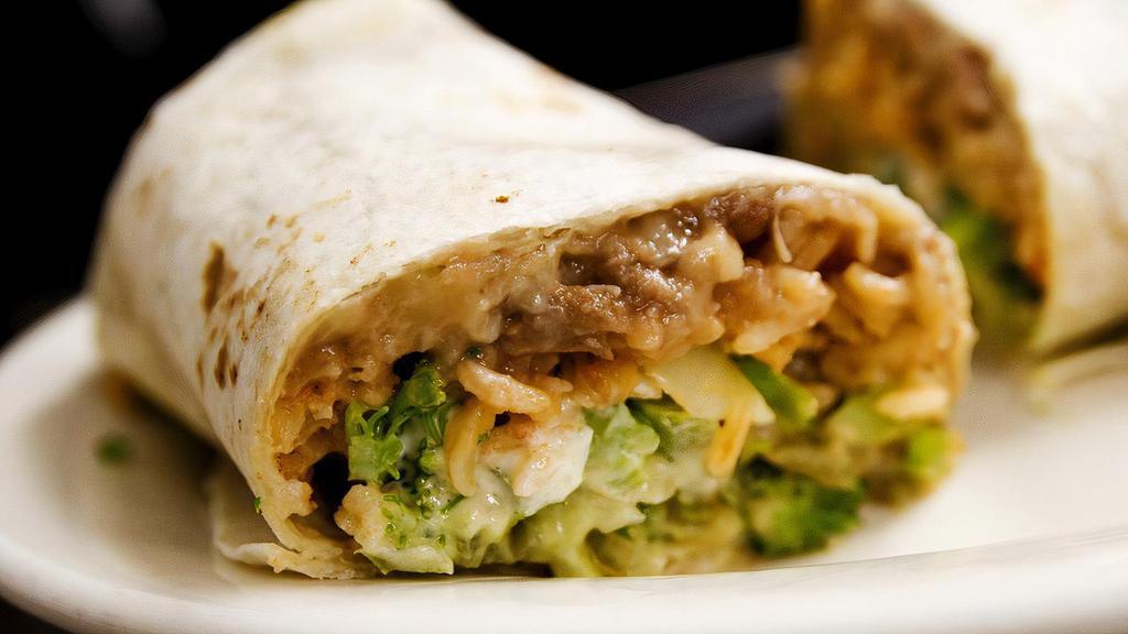 Grilled Veggies Burrito · Served with salad and corn chips.