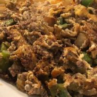 The big scramble · Ground beef sauteed with chopped onions, bell peppers then scrambled with 2 large country fr...