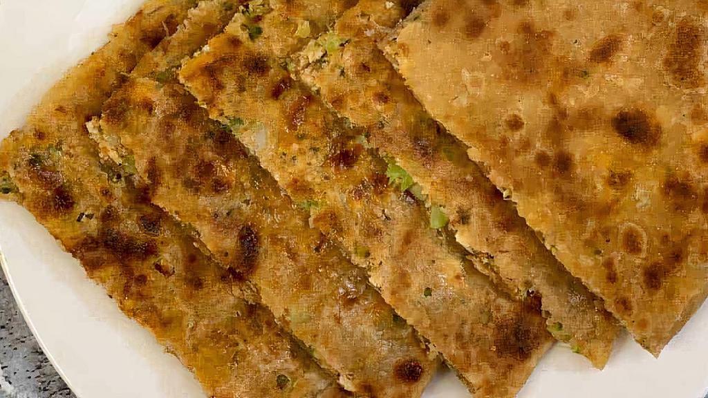 Paneer Paratha · Quantity: 2 with No Onion and No Garlic Pickle + Dahi
A flatbread made whole wheat flour stuffed with savory, spiced grated cheese roasted in ghee or oil